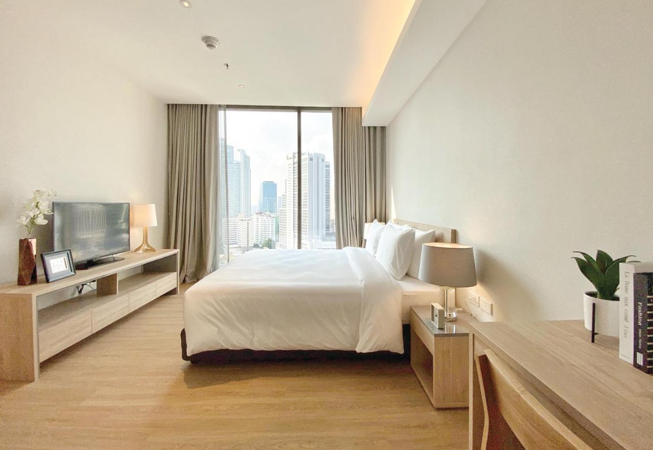 Oakwood Suites Μπανγκόκ Εξωτερικό φωτογραφία A bedroom at the hotel